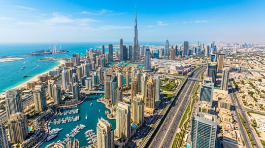 Investing in Dubai — aerial view of the Dubai skyline with Burj Khalifa and Dubai Marina
